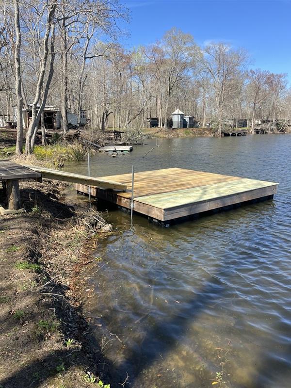 Gator timber floating dock connected to the shore by a walkway